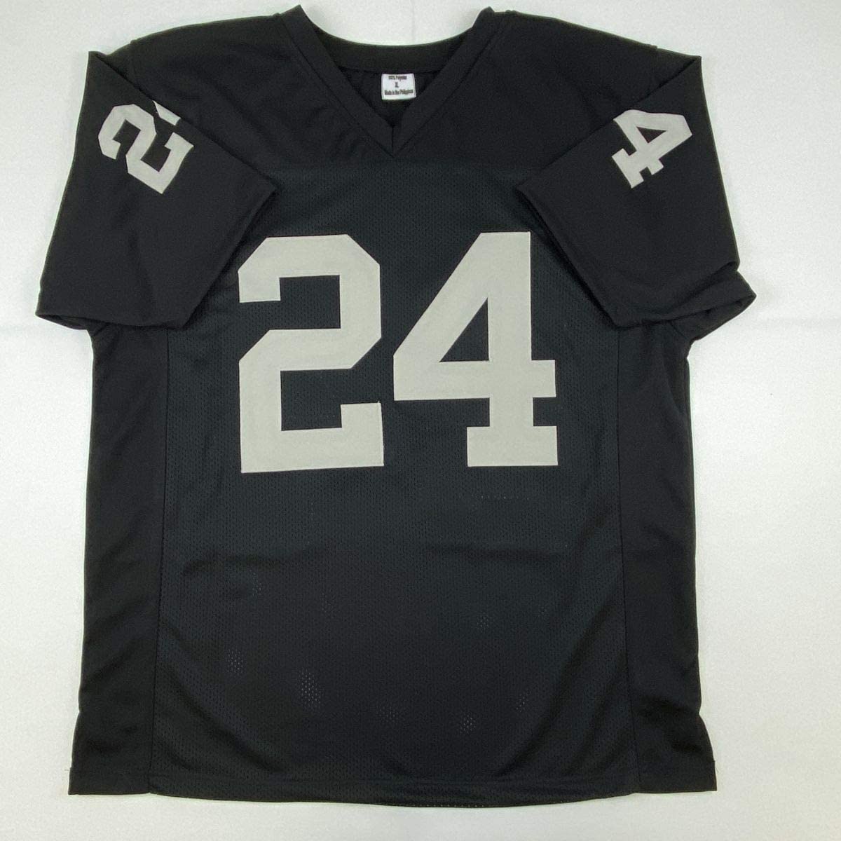 Autographed/Signed Charles Woodson Oakland Black Football Jersey Beckett BAS COA