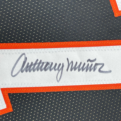 Framed Autographed/Signed Anthony Munoz 35x39 Cincinnati Black Football Jersey JSA COA