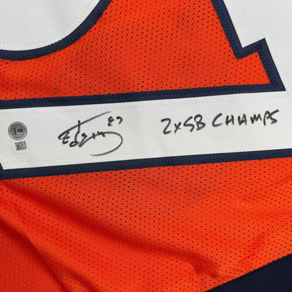 Autographed/Signed Ed McCaffrey 2x SB Champs Denver Orange Football Jersey Beckett BAS COA