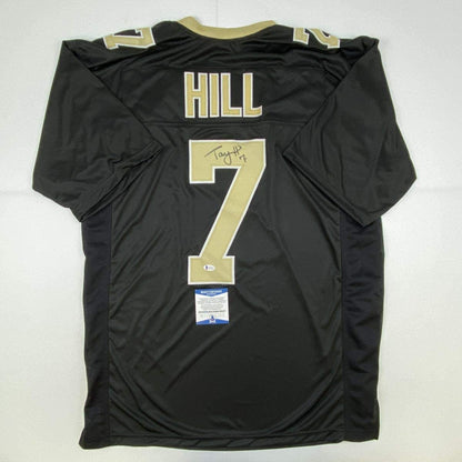 Autographed/Signed Taysom Hill New Orleans Black Football Jersey Beckett BAS COA
