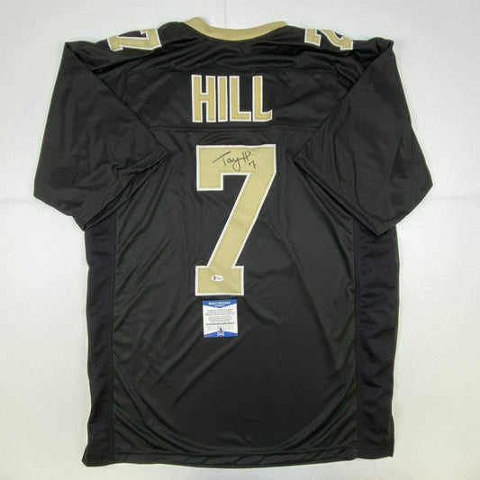 Autographed/Signed Taysom Hill New Orleans Black Football Jersey Beckett BAS COA