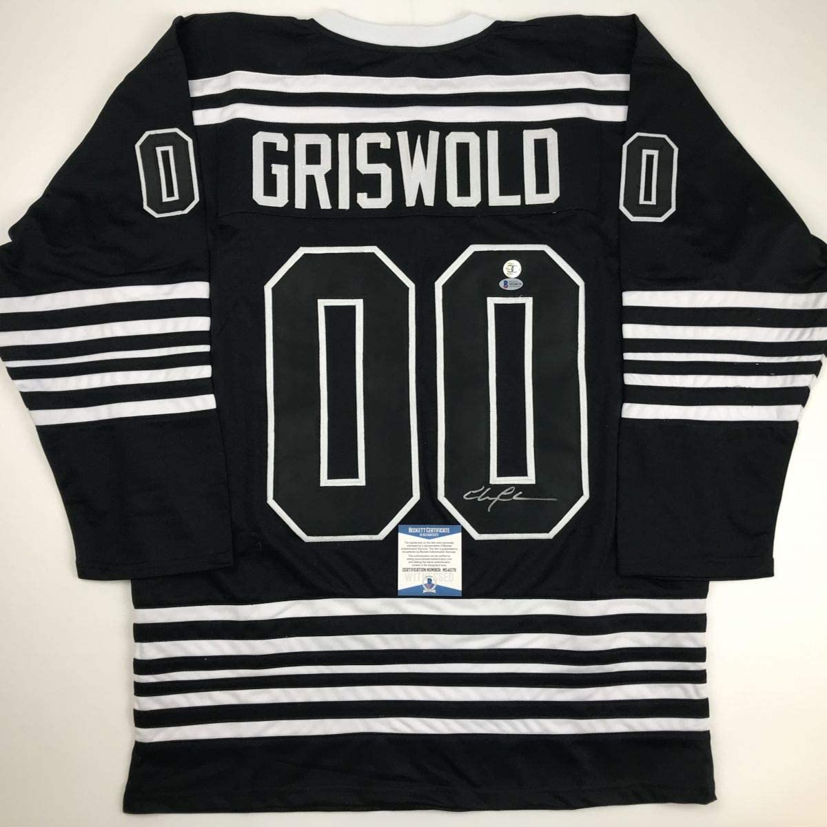 Autographed/Signed Chevy Chase Clark Griswold Christmas Vacation Movie Chicago Black Hockey Jersey Beckett BAS COA