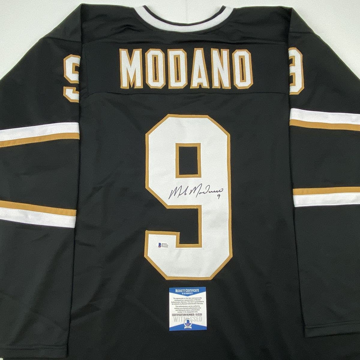 Autographed/Signed Mike Modano Dallas Black Hockey Jersey Beckett BAS COA
