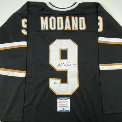 Autographed/Signed Mike Modano Dallas Black Hockey Jersey Beckett BAS COA
