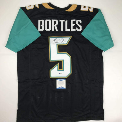 Autographed/Signed Blake Bortles Jacksonville Black Football Jersey Beckett BAS COA