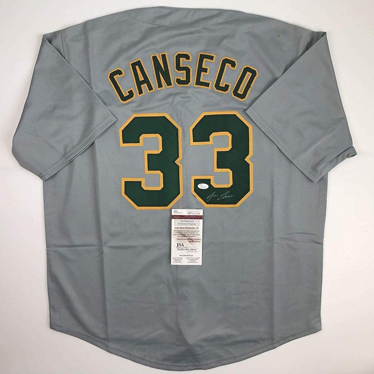 Autographed/Signed Jose Canseco Oakland Grey Baseball Jersey JSA COA