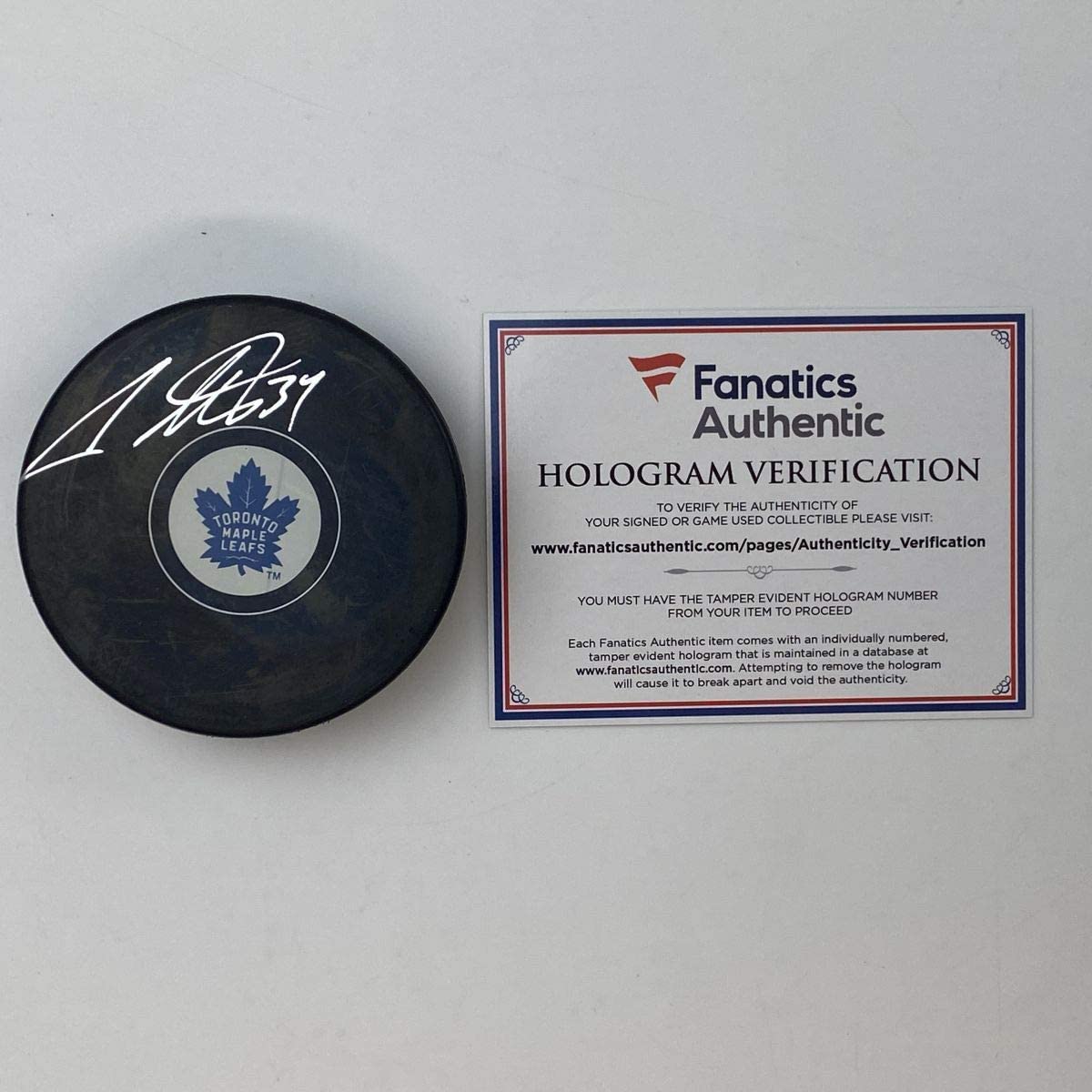 Autographed/Signed Auston Matthews Toronto Maple Leafs Logo Hockey Puck Fanatics COA