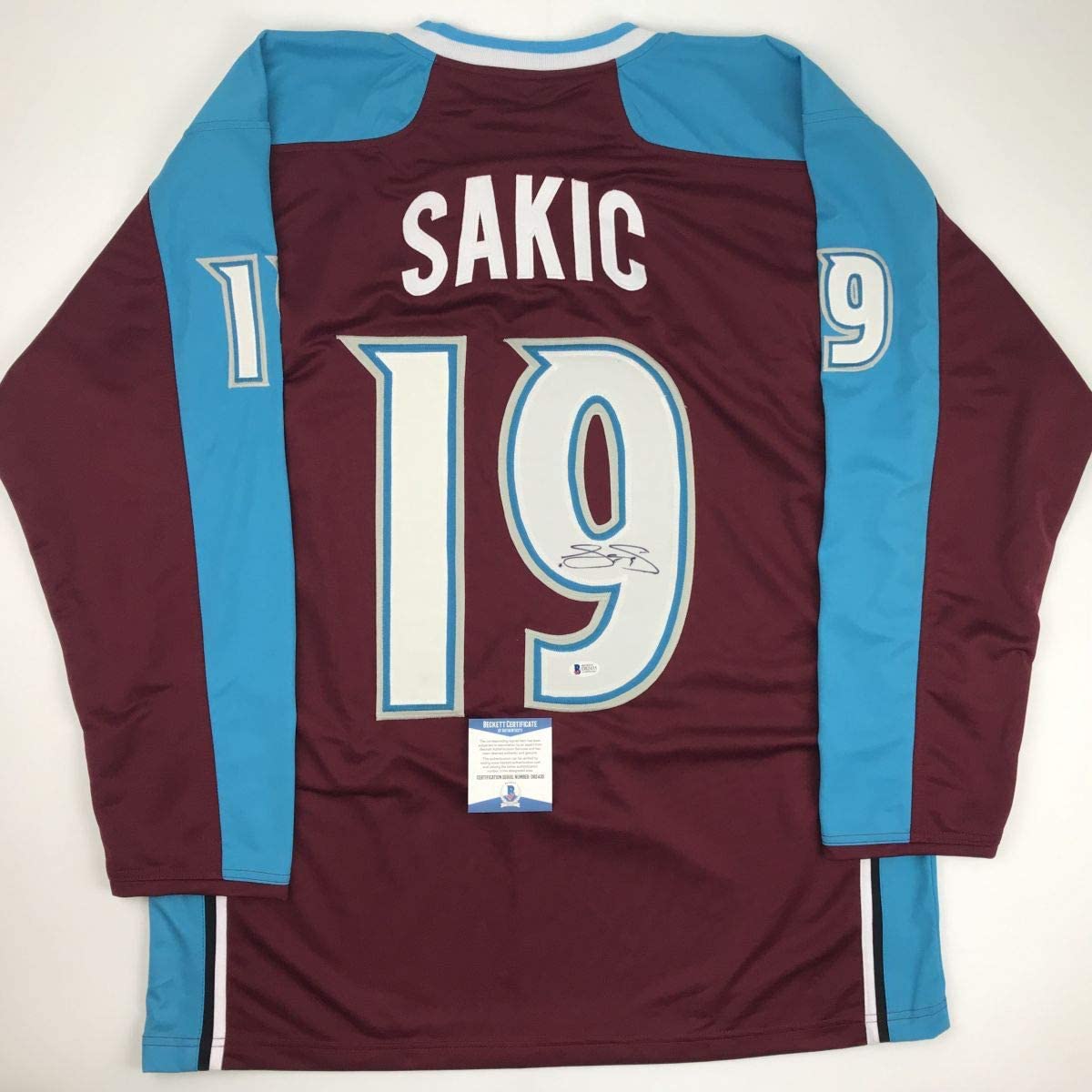 Autographed/Signed Joe Sakic Colorado Maroon Hockey Jersey Beckett BAS COA