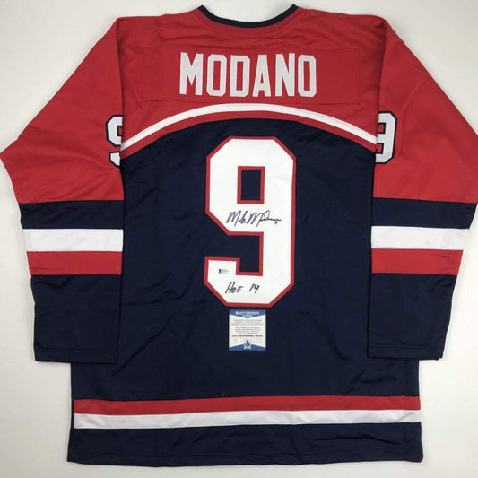 Autographed/Signed Mike Modano HOF 2014 United States USA Blue Hockey Jersey Beckett BAS COA