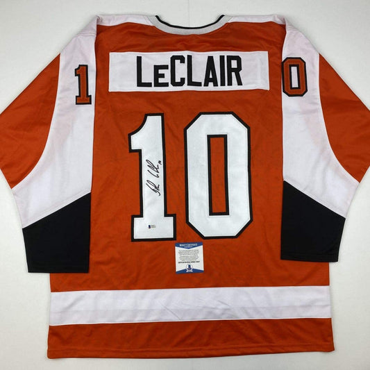 Autographed/Signed John LeClair Philadelphia Orange Hockey Jersey Beckett BAS COA