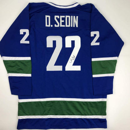Autographed/Signed Daniel Sedin Vancouver Blue Hockey Jersey JSA COA Holo Only