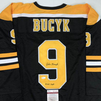 Autographed/Signed Johnny John Bucyk HOF 1981 Boston Black Hockey Jersey JSA COA