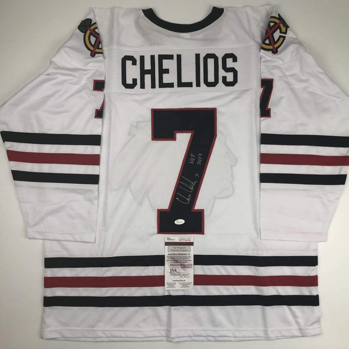 Autographed/Signed Chris Chelios HOF 2013 Chicago White Hockey Jersey JSA COA