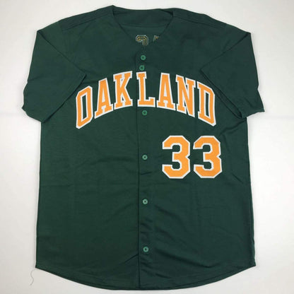 Autographed/Signed Jose Canseco Oakland Dark Green Baseball Jersey JSA COA