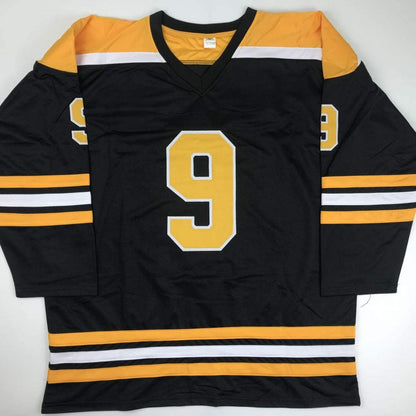 Autographed/Signed Johnny John Bucyk HOF 1981 Boston Black Hockey Jersey JSA COA