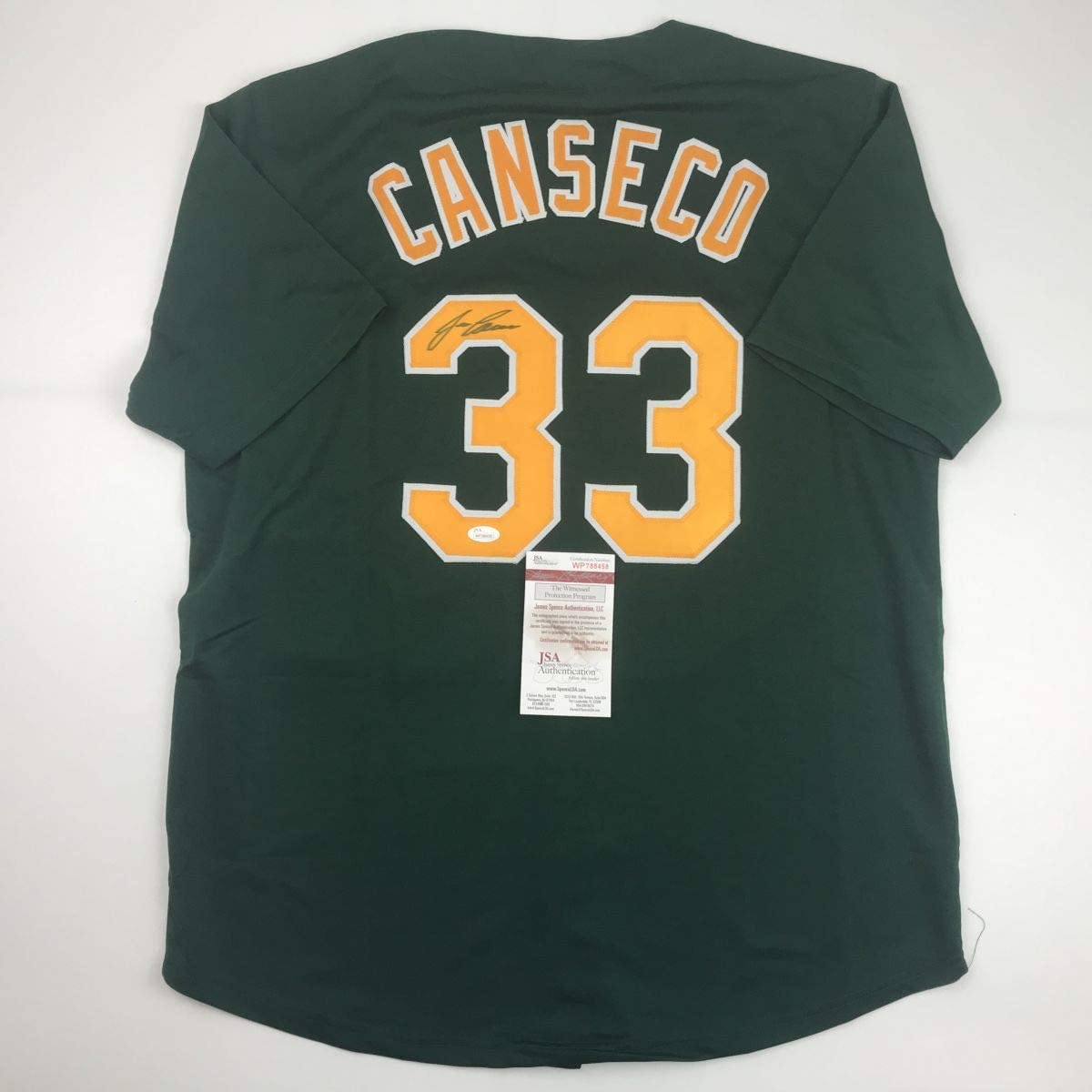 Autographed/Signed Jose Canseco Oakland Dark Green Baseball Jersey JSA COA