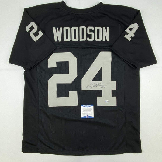 Autographed/Signed Charles Woodson Oakland Black Football Jersey Beckett BAS COA