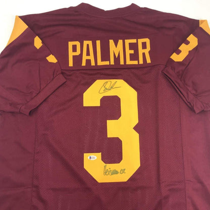 Autographed/Signed Carson Palmer Heisman 02 USC Southen Cal Maroon College Football Jersey Beckett BAS COA