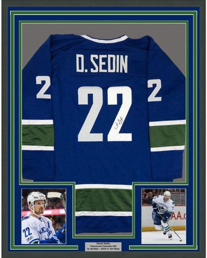 Framed Autographed/Signed Daniel Sedin 35x39 Vancouver Blue Hockey Jersey JSA COA Holo Only