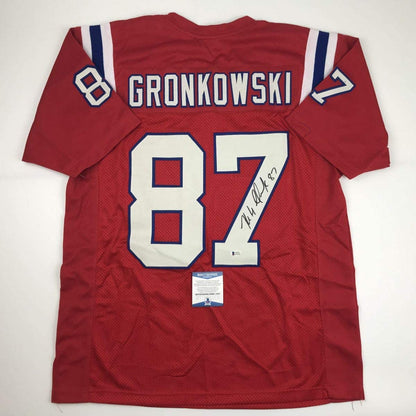 Autographed/Signed Rob Gronkowski New England Red Football Jersey Beckett BAS COA
