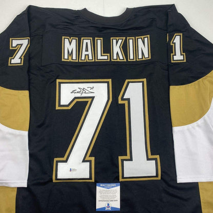 Autographed/Signed Evgeni Malkin Pittsburgh Black Hockey Jersey Beckett BAS COA