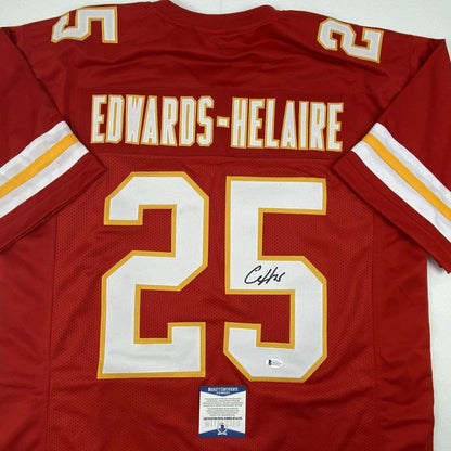 Autographed/Signed Clyde Edwards-Helaire Kansas City Red Football Jersey Beckett BAS COA