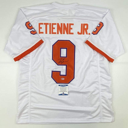 Autographed/Signed Travis Etienne Jr. Clemson White College Football Jersey Beckett BAS COA