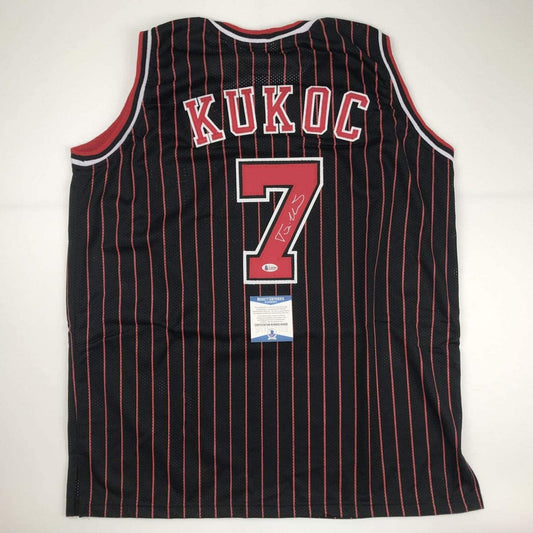 Autographed/Signed Toni Kukoc Chicago Black Pinstripe Basketball Jersey Beckett BAS COA