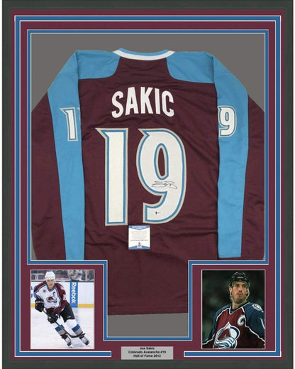 Framed Autographed/Signed Joe Sakic 35x39 Colorado Maroon Hockey Jersey Beckett BAS COA