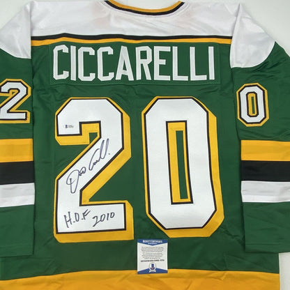 Autographed/Signed Dino Ciccarelli HOF 2010 Minnesota Green Hockey Jersey Beckett BAS COA