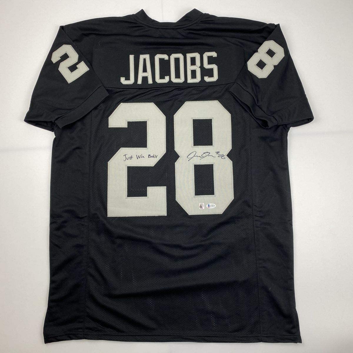 Autographed/Signed Josh Jacobs Just Win Baby Las Vegas Oakland Black Football Jersey Beckett BAS COA