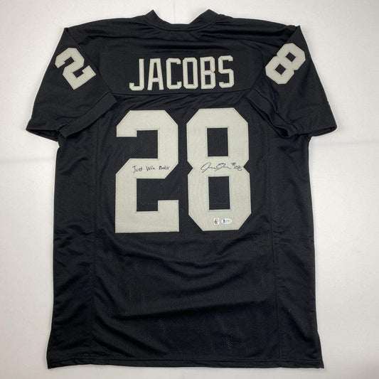 Autographed/Signed Josh Jacobs Just Win Baby Las Vegas Oakland Black Football Jersey Beckett BAS COA