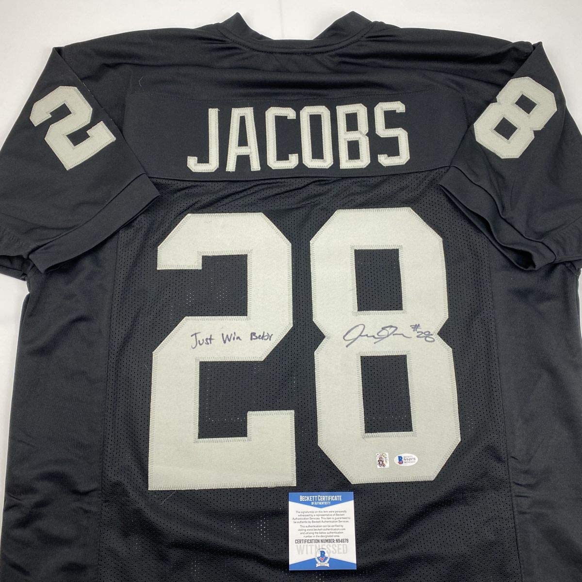 Autographed/Signed Josh Jacobs Just Win Baby Las Vegas Oakland Black Football Jersey Beckett BAS COA