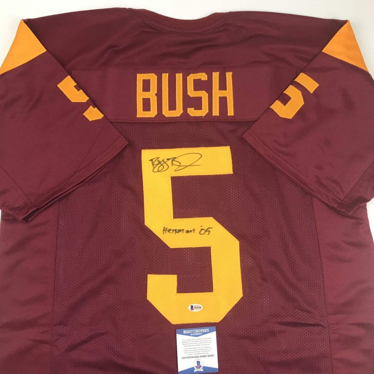 Autographed/Signed Reggie Bush 05 Heisman USC Southen Cal Maroon College Football Jersey Beckett BAS COA