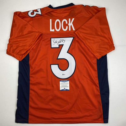 Autographed/Signed Drew Lock Denver Orange Football Jersey Beckett BAS COA
