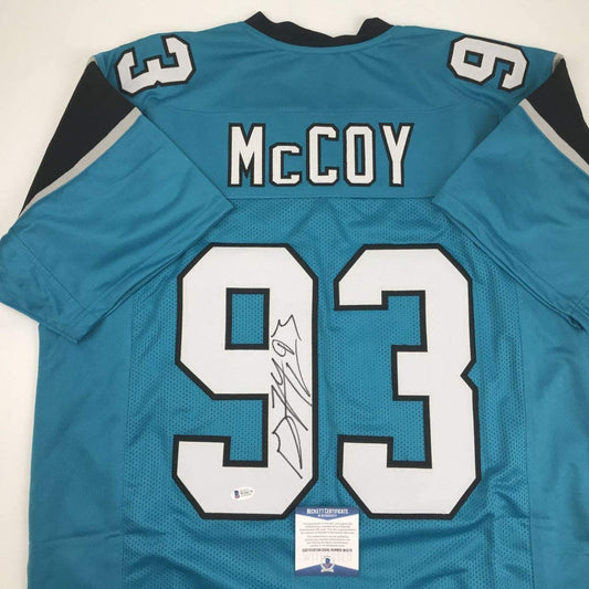 Autographed/Signed Gerald McCoy Carolina Blue Football Jersey JSA COA