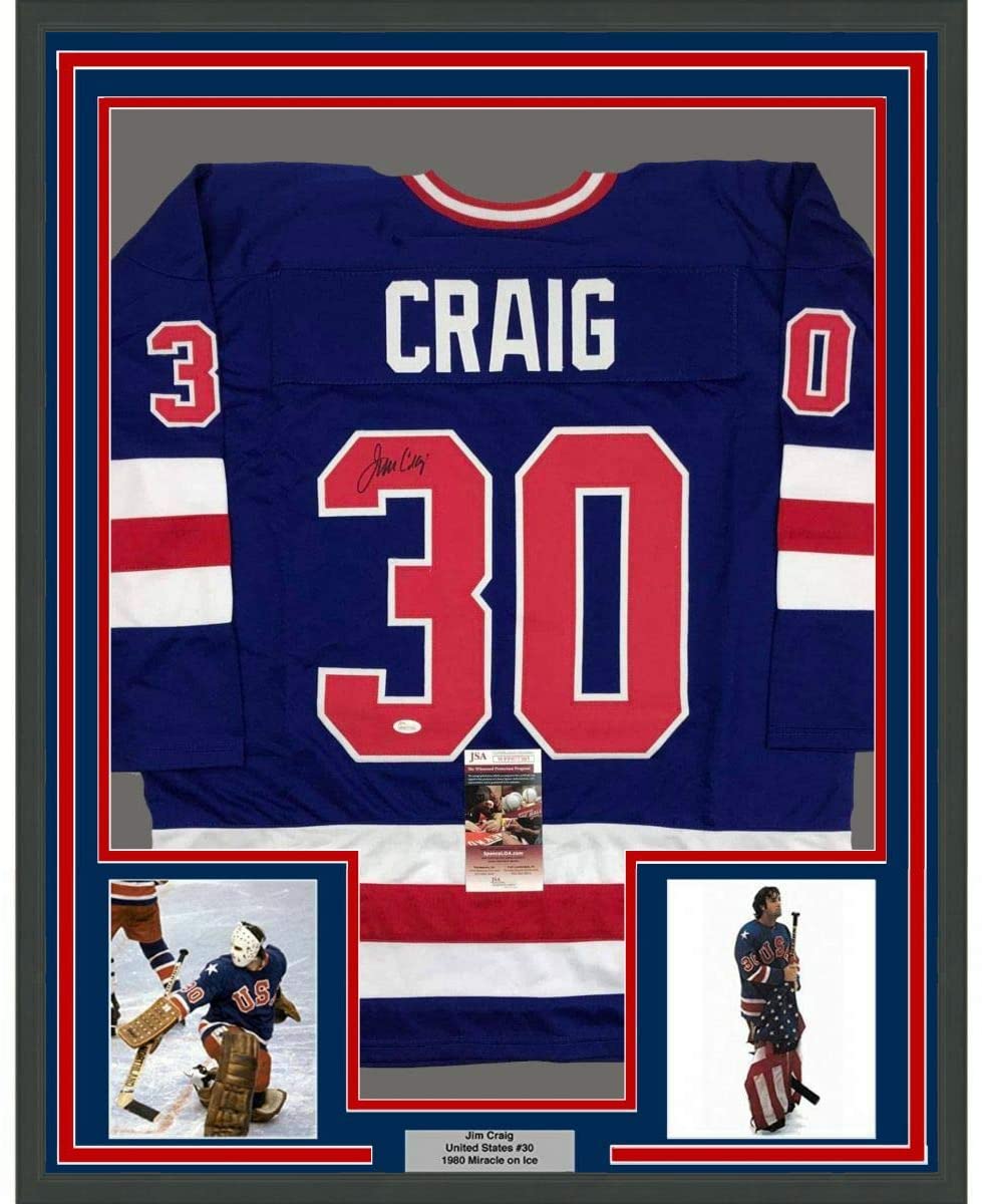 Framed Autographed/Signed Jim Craig 35x39 Blue 1980 Miracle On Ice United States Hockey Jersey JSA COA