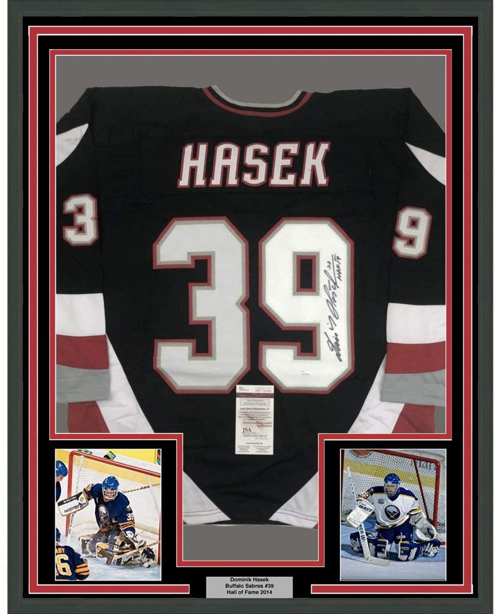 Framed Autographed/Signed Dominik Hasek HOF 14 35x39 Buffalo Black Hockey Jersey JSA COA