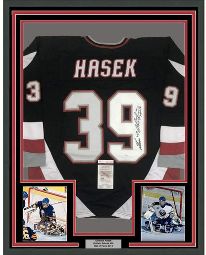 Framed Autographed/Signed Dominik Hasek HOF 14 35x39 Buffalo Black Hockey Jersey JSA COA