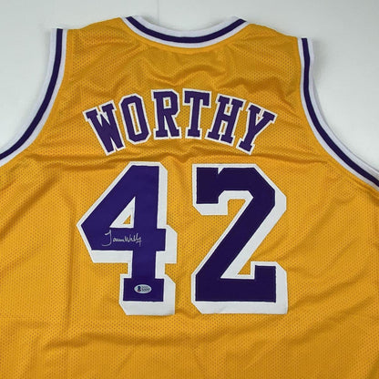 Autographed/Signed James Worthy Los Angeles LA Yellow Basketball Jersey Beckett BAS COA