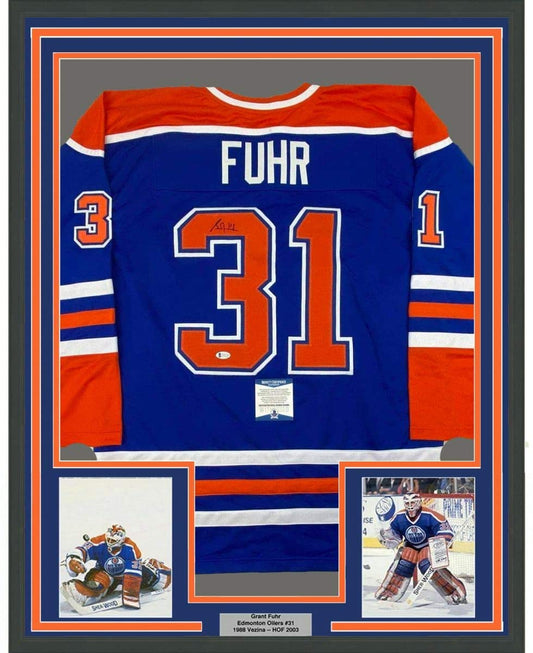 Framed Autographed/Signed Grant Fuhr 35x39 Edmonton Blue Hockey Jersey Beckett BAS COA