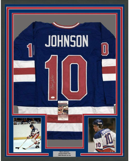 Framed Autographed/Signed Mark Johnson 35x39 Blue Team USA Miracle On Ice 1980 Olympics Hockey Jersey JSA COA
