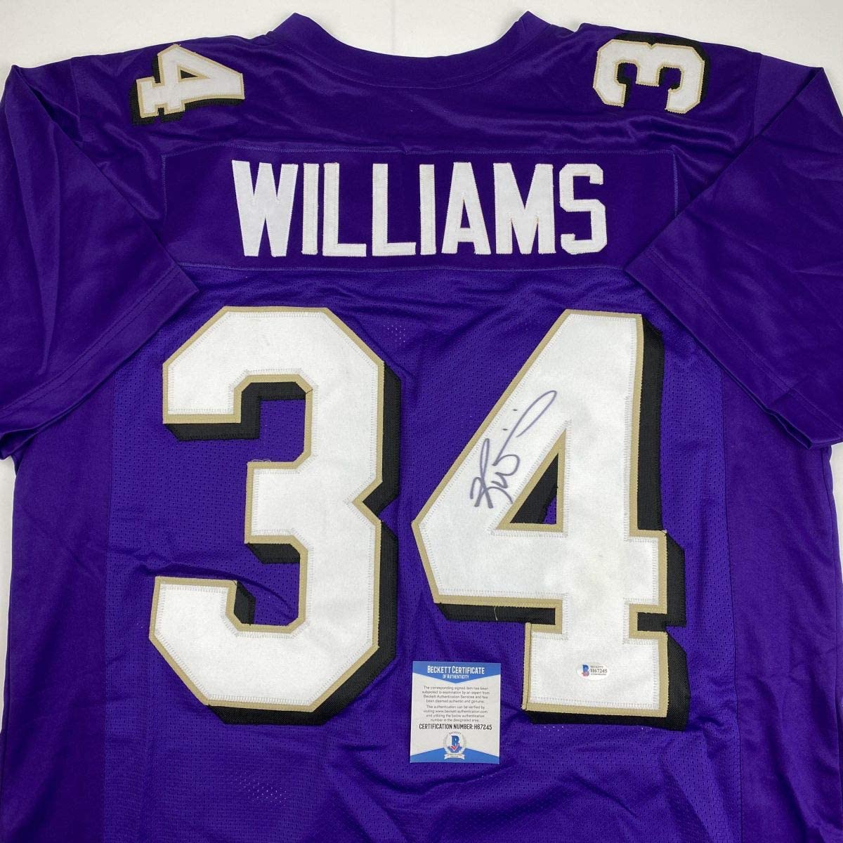 Autographed/Signed Ricky Williams Baltimore Purple Football Jersey Beckett BAS COA