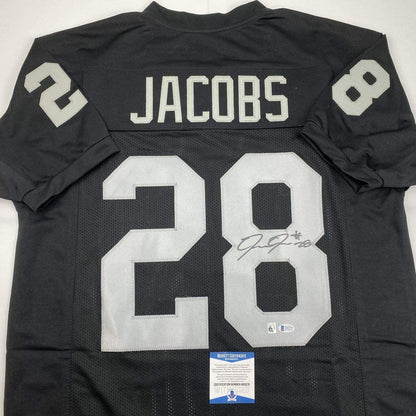 Autographed/Signed Josh Jacobs Las Vegas Oakland Black Football Jersey Beckett BAS COA