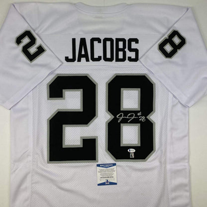 Autographed/Signed Josh Jacobs Las Vegas Oakland White Football Jersey Beckett BAS COA