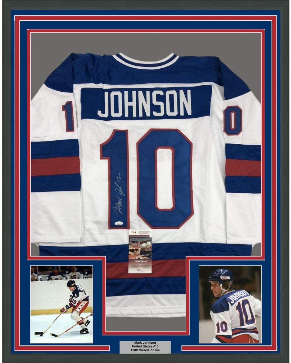 Framed Autographed/Signed Mark Johnson 35x39 White Team USA Miracle On Ice 1980 Olympics Hockey Jersey JSA COA