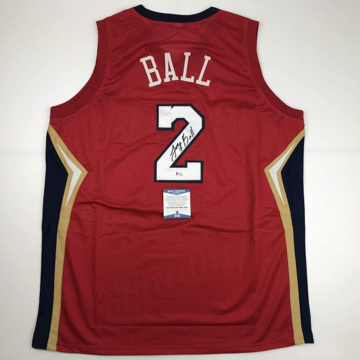 Autographed/Signed Lonzo Ball New Orleans Red Basketball Jersey Beckett BAS COA