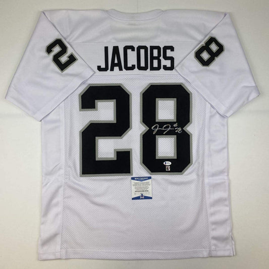 Autographed/Signed Josh Jacobs Las Vegas Oakland White Football Jersey Beckett BAS COA