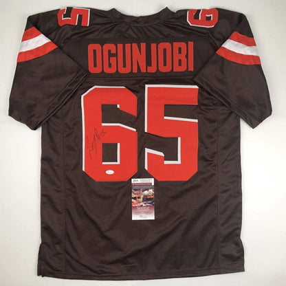 Autographed/Signed Larry Ogunjobi Cleveland Football Brown Jersey JSA COA