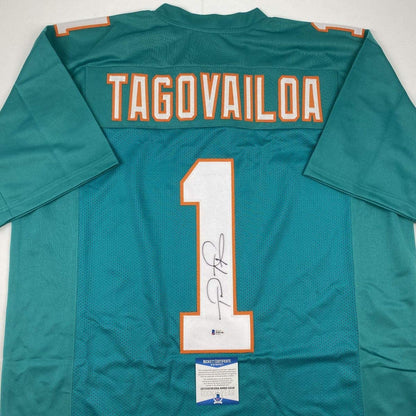 Autographed/Signed Tua Tagovailoa Miami Teal Football Jersey Beckett BAS COA